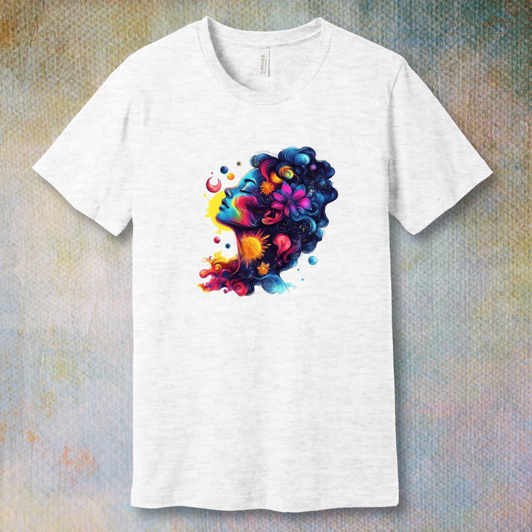 Colorful cosmic art T-shirt of a woman's face blending with stars, planets, and swirling energy—representing dreams, imagination, and universal beauty.