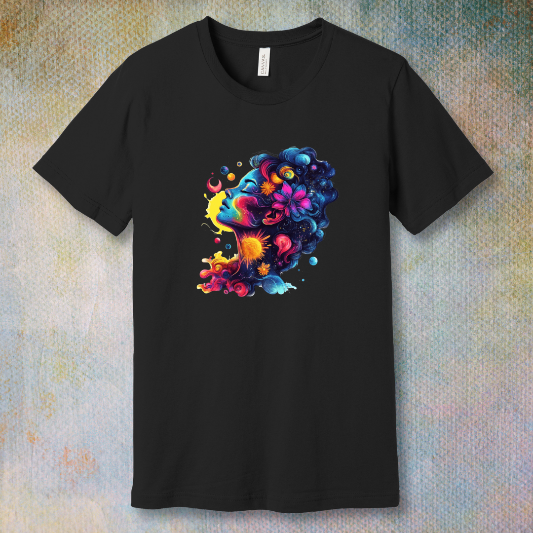 Colorful cosmic art T-shirt of a woman's face blending with stars, planets, and swirling energy—representing dreams, imagination, and universal beauty.