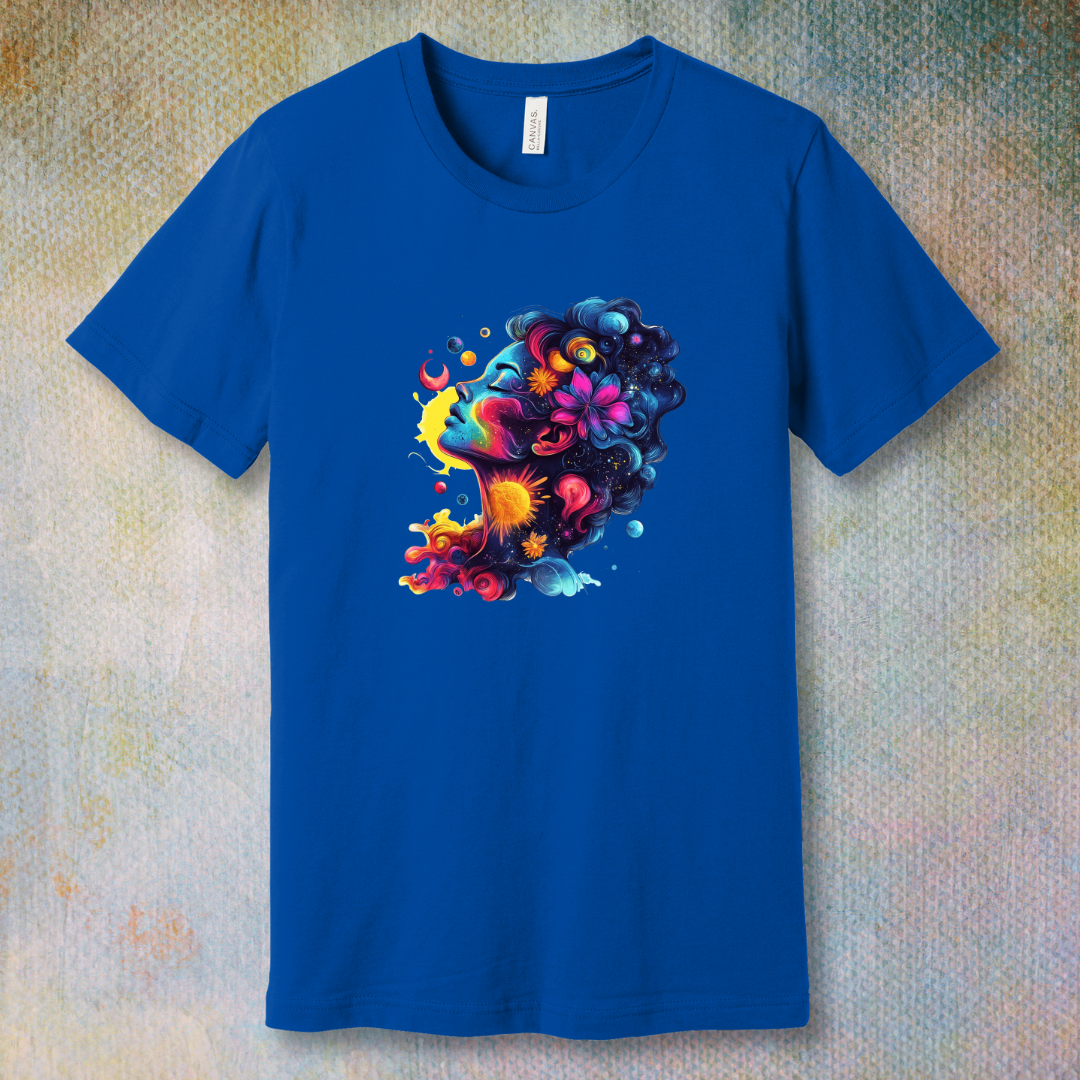 Colorful cosmic art T-shirt of a woman's face blending with stars, planets, and swirling energy—representing dreams, imagination, and universal beauty.