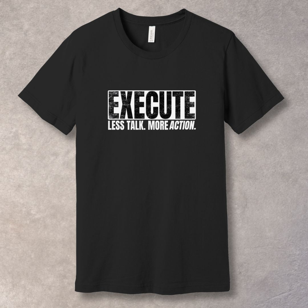 Black unisex T-shirt with bold “EXECUTE” graphic and “Less Talk. More Action.” motivational quote in distressed typography.