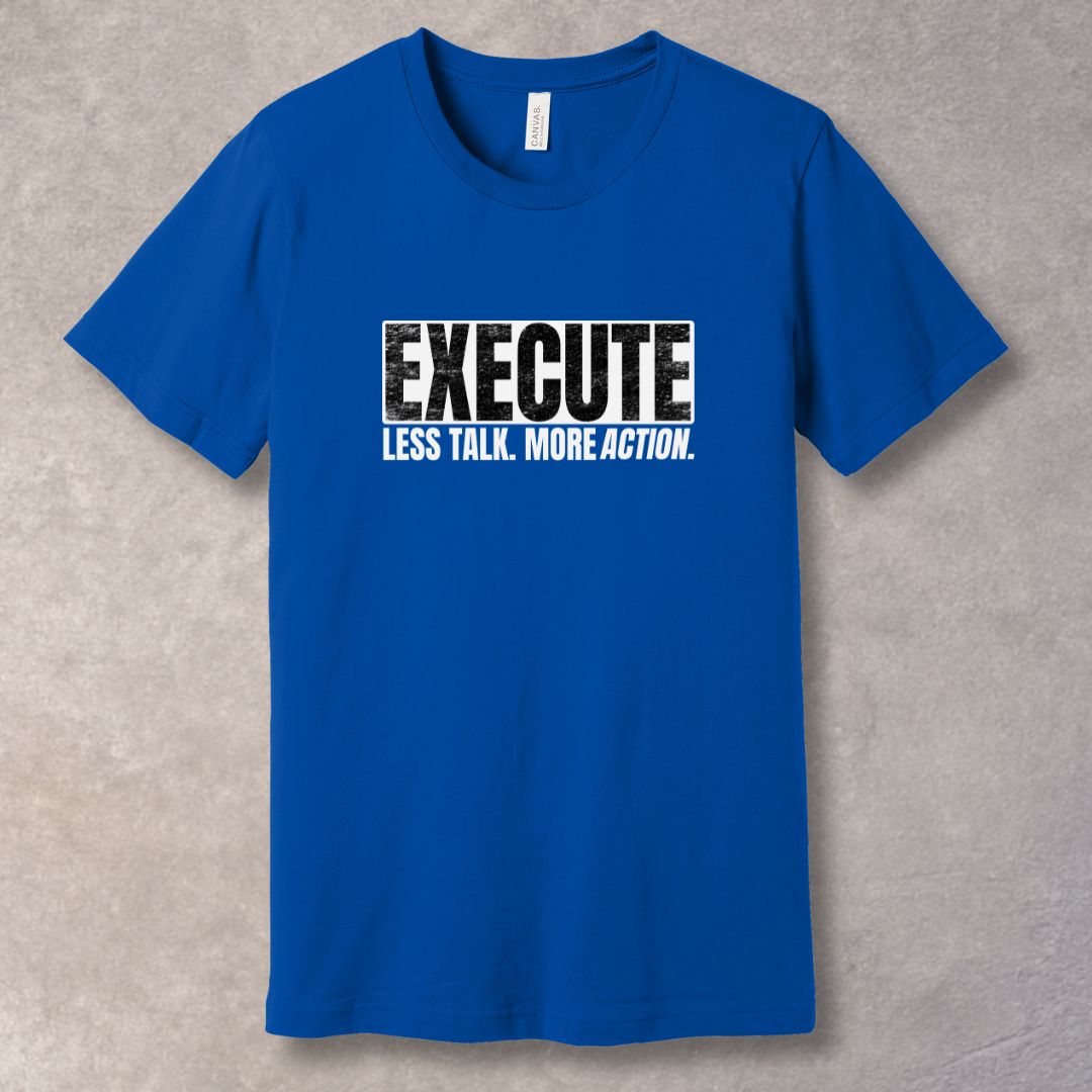 Blue unisex T-shirt with bold “EXECUTE” graphic and “Less Talk. More Action.” motivational quote in distressed typography.