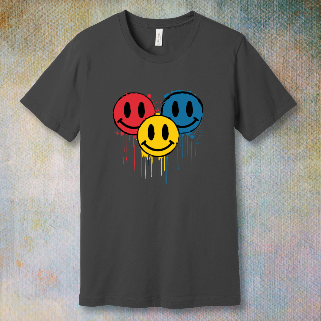 Drip Smile t-shirt — red, yellow, and blue smiley faces dripping paint on asphalt tee