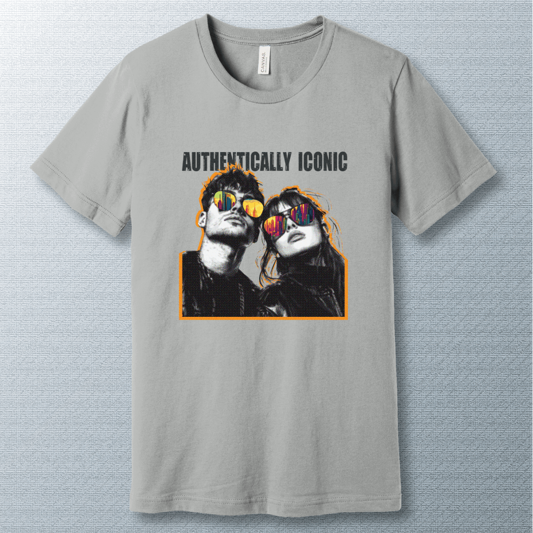 Pop art style design of a confident man and woman wearing sunglasses with colorful city reflections, under the bold text "AUTHENTICALLY ICONIC" – T-shirt.