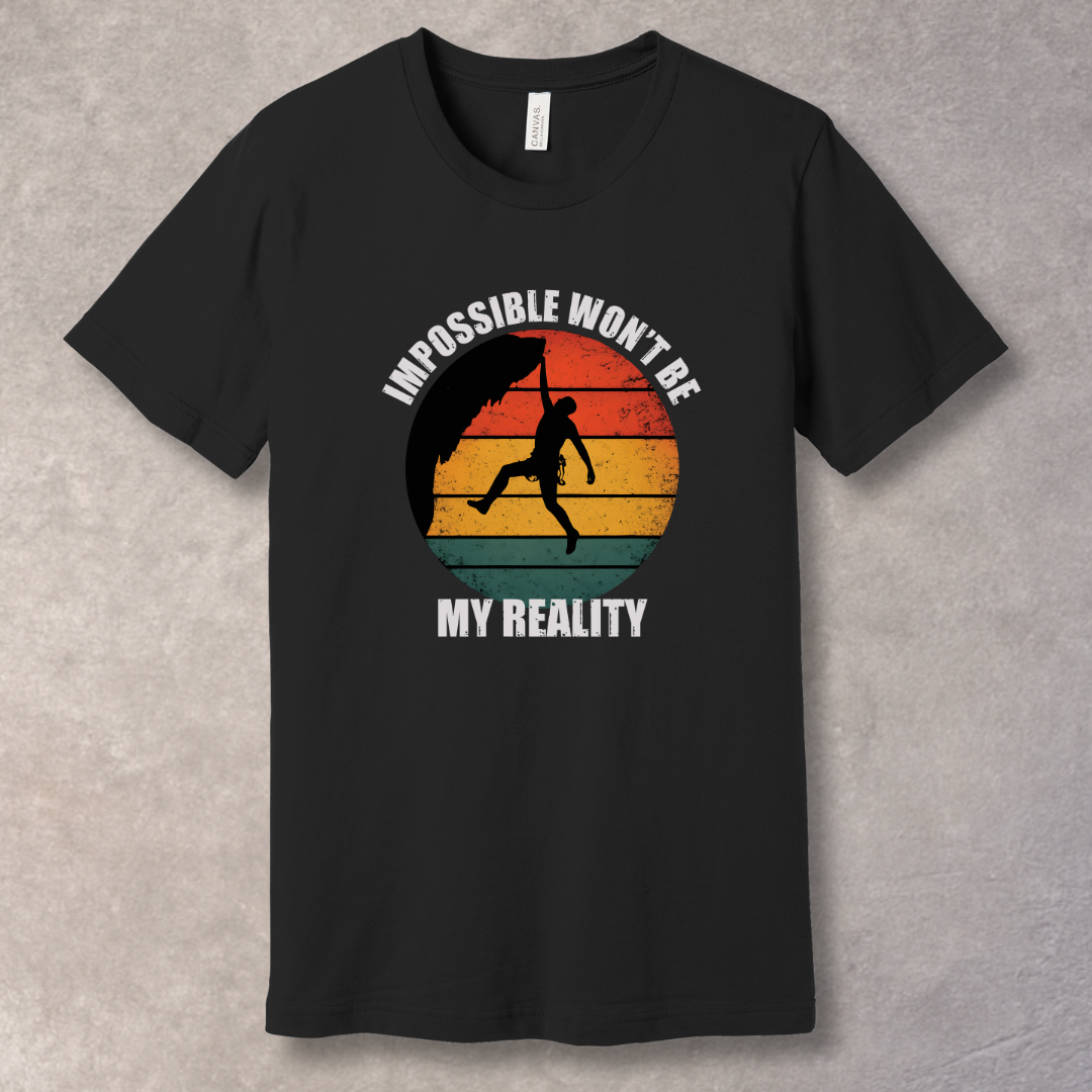 Black T-shirt with rock climber silhouette over retro sunset with text “Impossible Won’t Be My Reality”