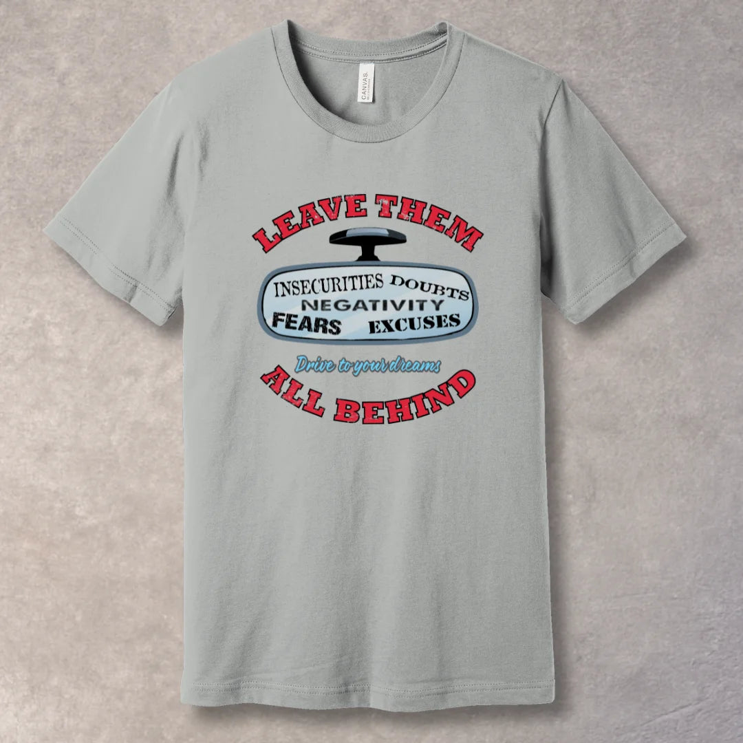 Silver motivational T-shirt with “Leave Them All Behind” message and rear-view mirror graphic. Bold design for go-getters.