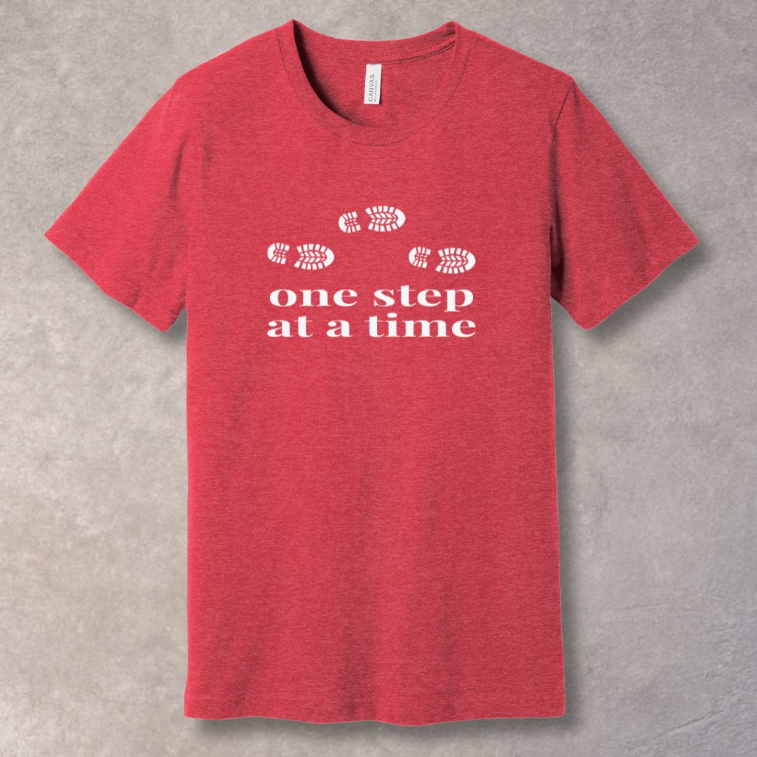 Heather Red t-shirt with 'one step at a time' text and footprints design