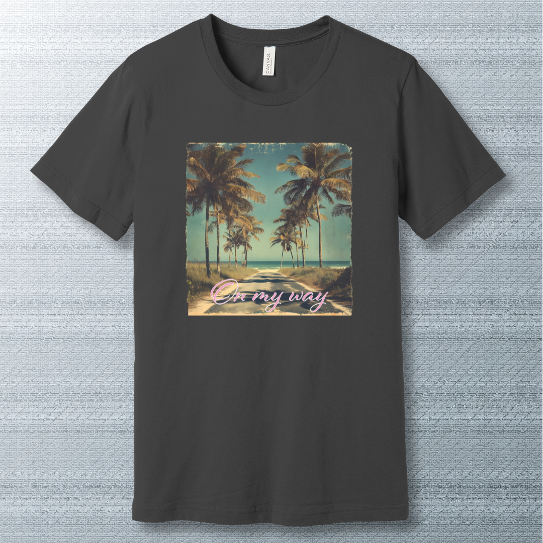 Tropical beach road lined with palm trees under a clear sky, with the phrase "On my way" in pink cursive script — vintage postcard-style design.