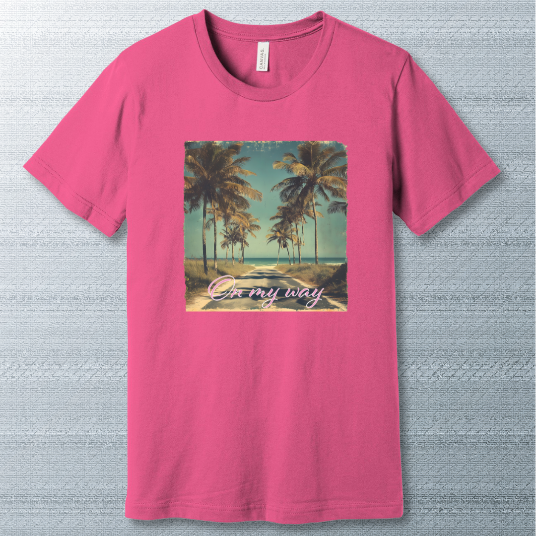 Tropical beach road lined with palm trees under a clear sky, with the phrase "On my way" in pink cursive script — vintage postcard-style design.