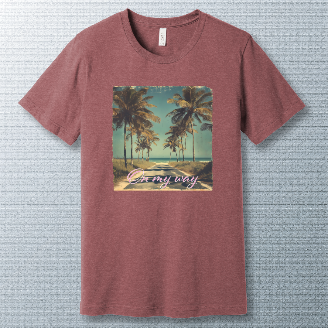 Tropical beach road lined with palm trees under a clear sky, with the phrase "On my way" in pink cursive script — vintage postcard-style design.
