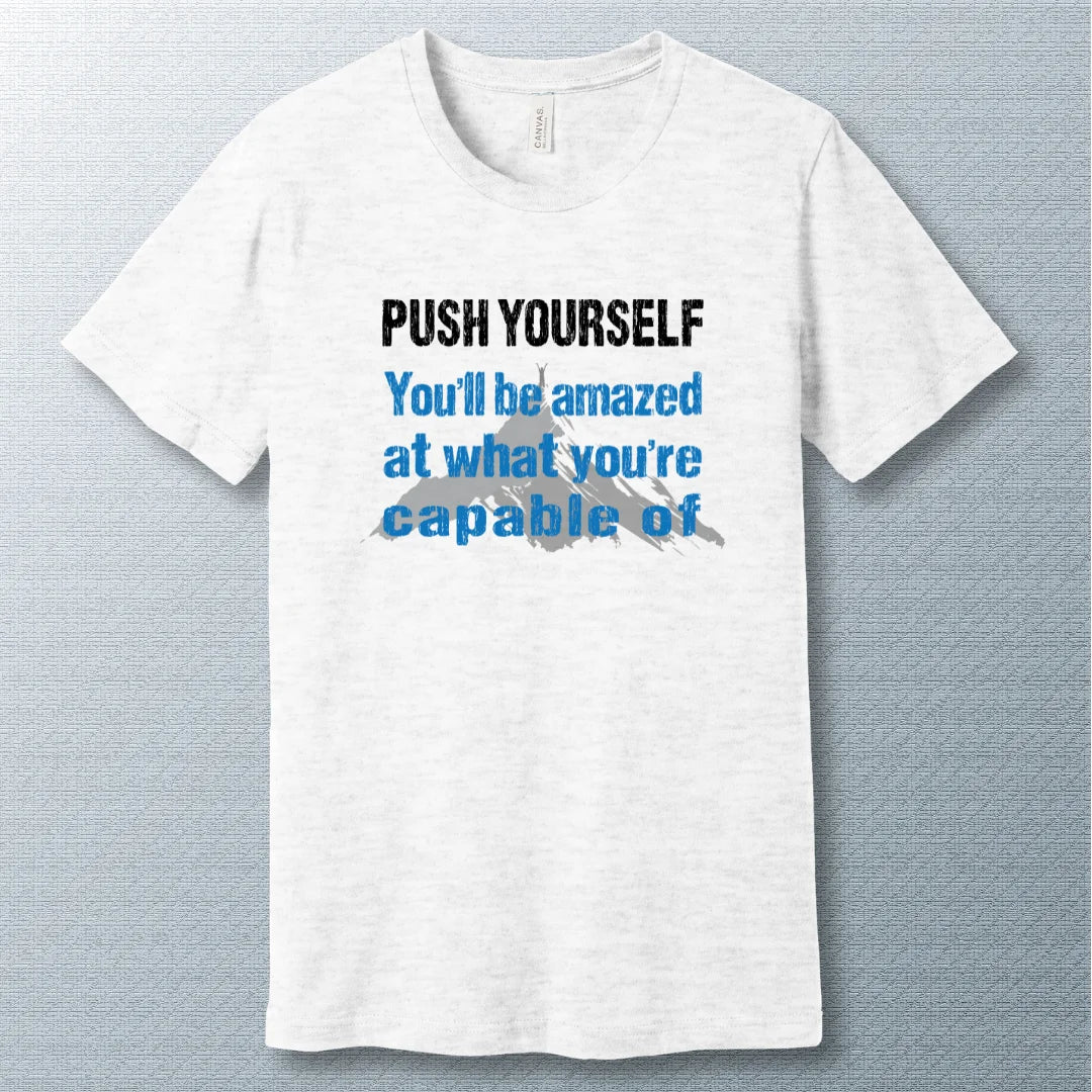 Motivational T-shirt that says "Push Yourself – You’ll be amazed at what you’re capable of" with mountain graphic