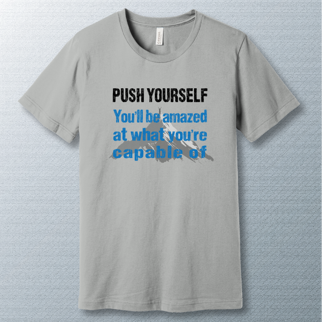 Motivational T-shirt that says "Push Yourself – You’ll be amazed at what you’re capable of" with mountain graphic
