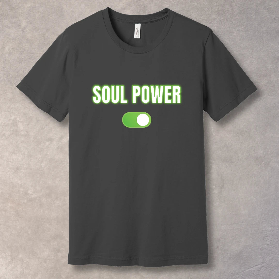 White text “SOUL POWER” with neon green glow above a bright green ON switch on an asphalt T-shirt – motivational graphic tee design.
