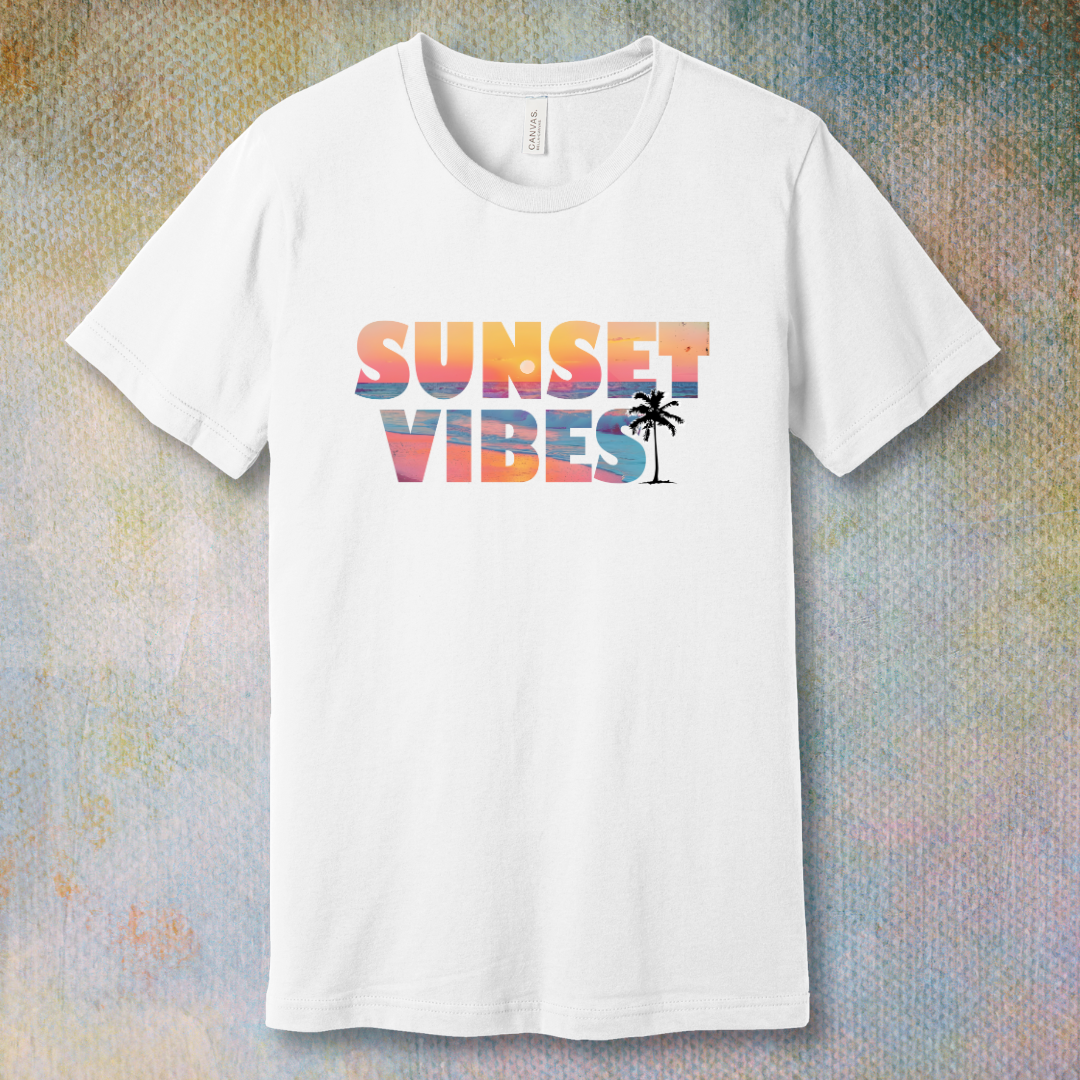 White T-shirt with a colorful 'Sunset Vibes' design featuring a stylized sun setting over waves – soft spiritual energy and summer vibes combined.