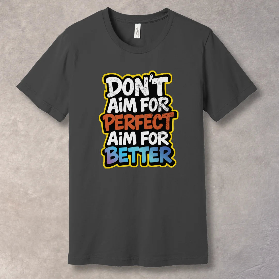Asphalt T-shirt with motivational text 'Don't Aim for Perfect, Aim for Better' in bold typography