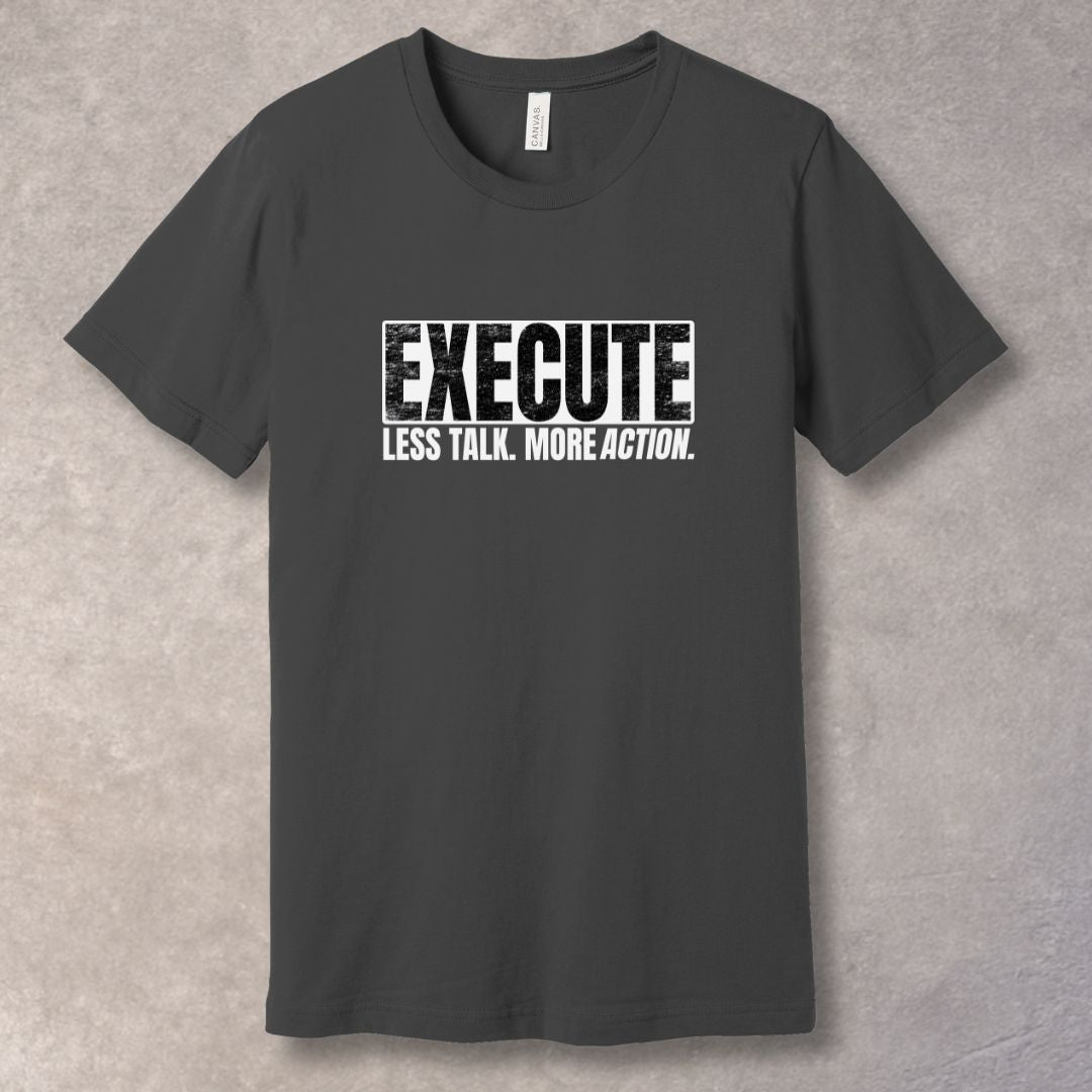 Gray unisex T-shirt with bold “EXECUTE” graphic and “Less Talk. More Action.” motivational quote in distressed typography.