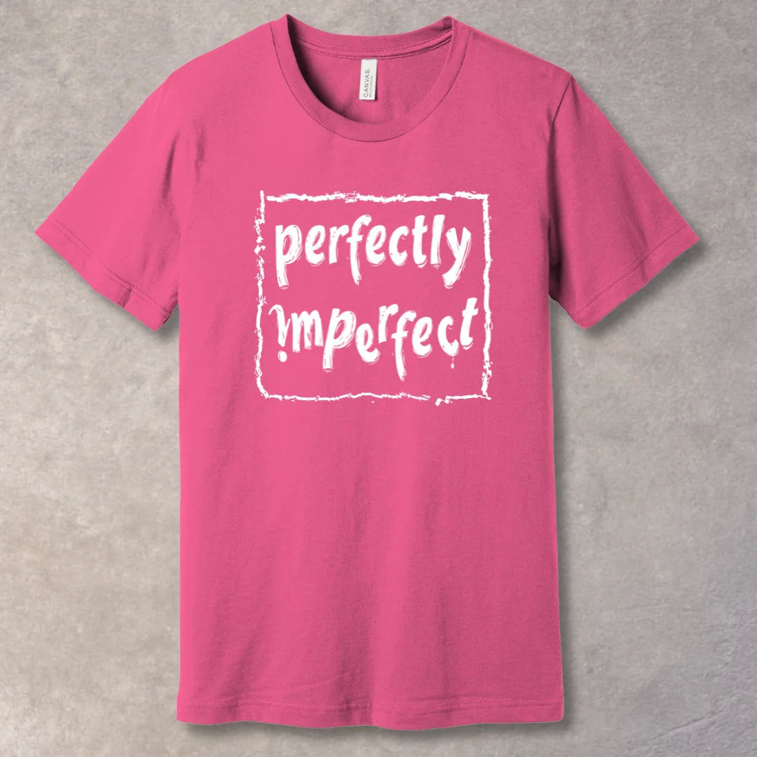 "Perfectly Imperfect" Charity Pink T-shirt – bold typography design promoting self-love and authenticity, to be worn by confident individuals