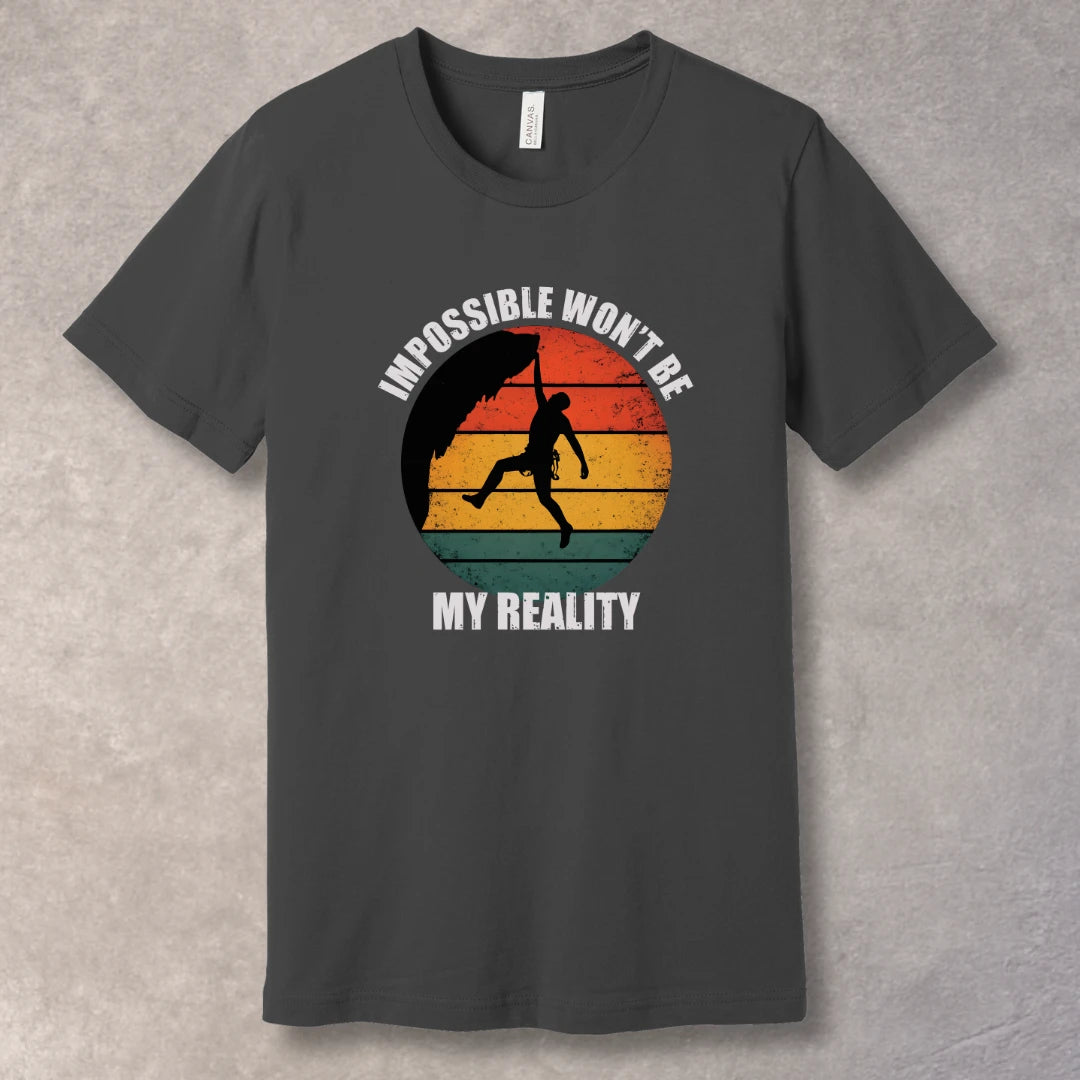 Asphalt T-shirt with rock climber silhouette over retro sunset with text “Impossible Won’t Be My Reality”