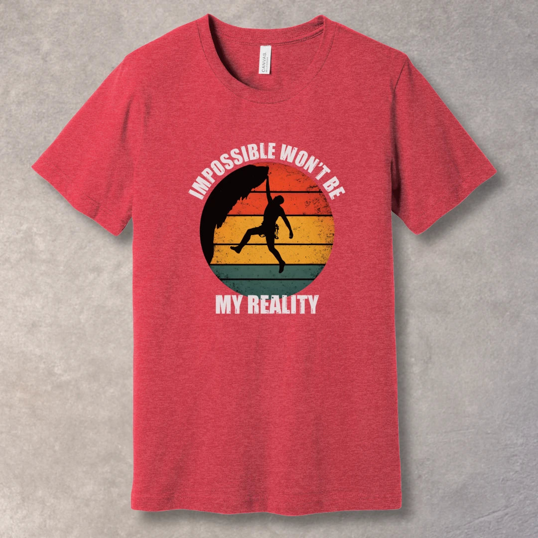 Heather Red T-shirt with rock climber silhouette over retro sunset with text “Impossible Won’t Be My Reality”