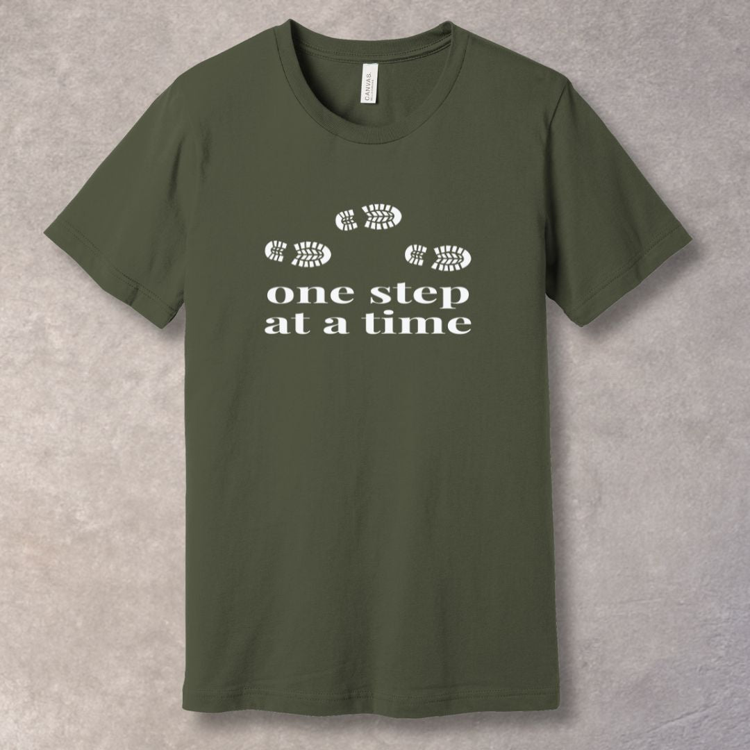 Army t-shirt with 'one step at a time' text and footprints design