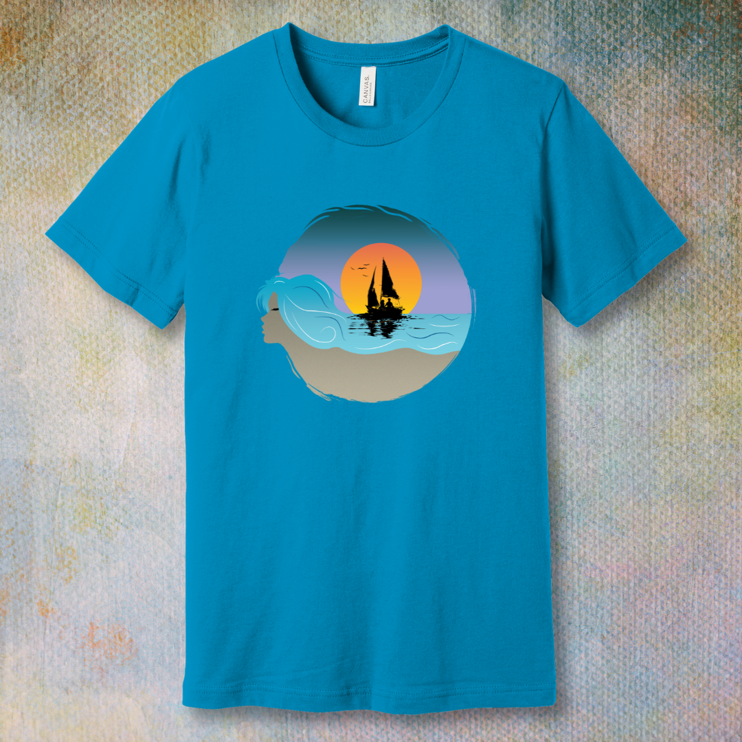 Aqua T-shirt with sailboat illustration and sunset sky, displayed flat on a soft background