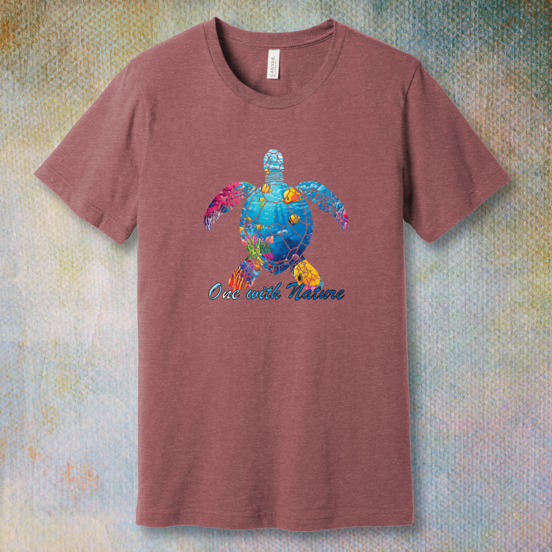 Heather Mauve T-shirt with a colorful sea turtle filled with ocean life and the phrase “One with Nature”