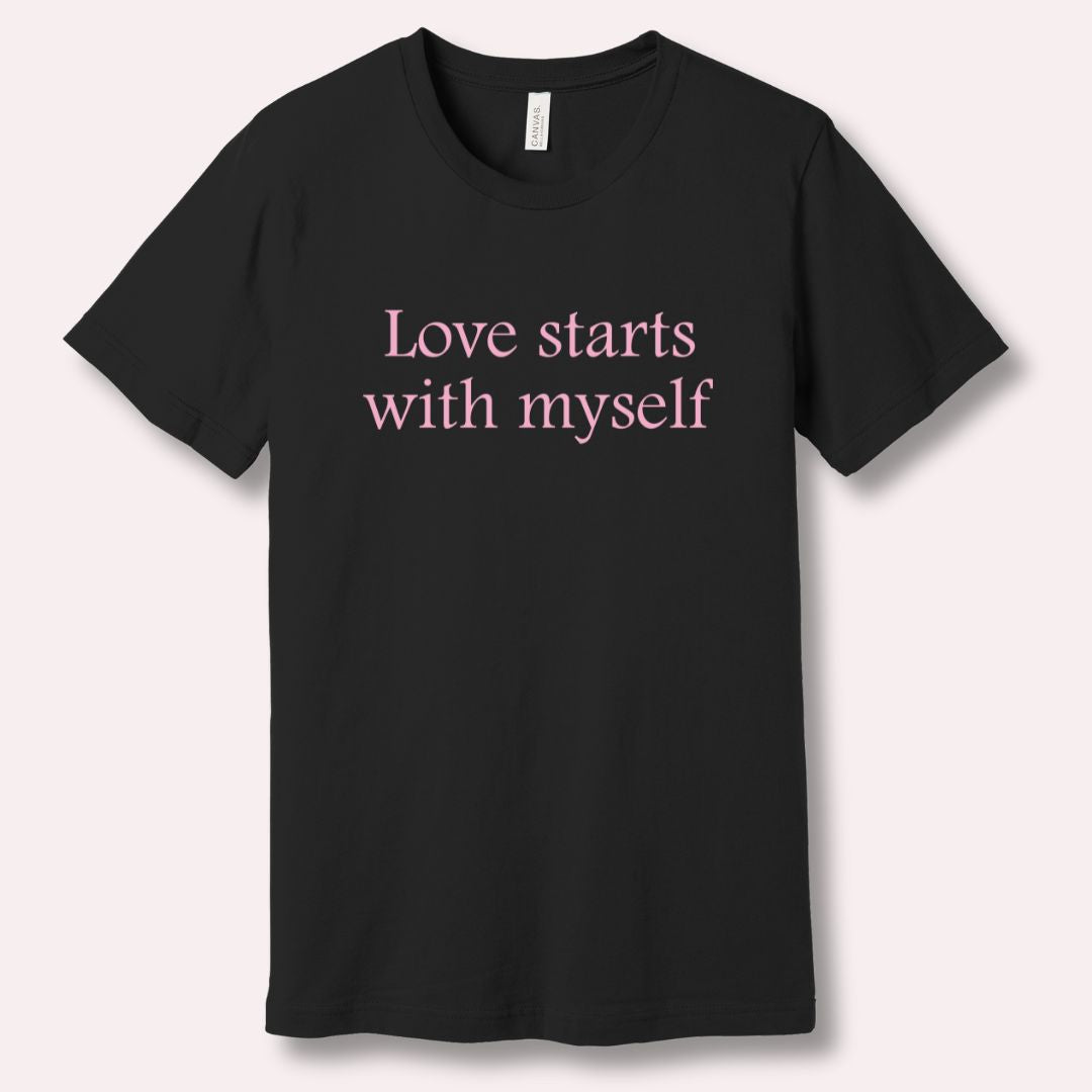 Black t-shirt with 'Love starts with myself' text in soft pink